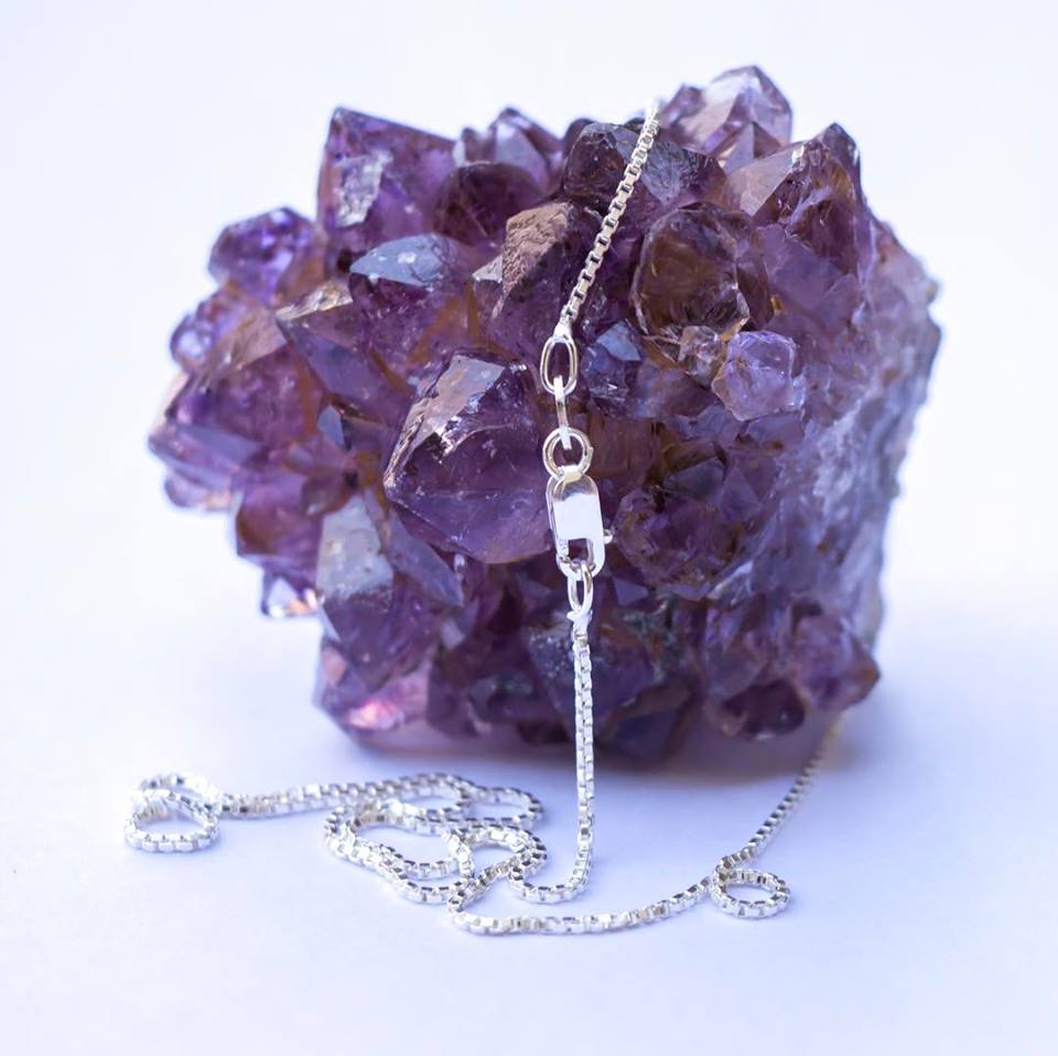 1MM Sterling Silver Box Chain with Lobster Claw Clasp. Displayed over an amethyst geode. 16"-36"