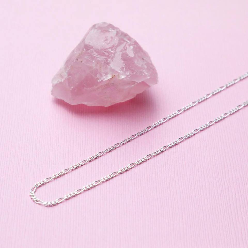 1.8MM Sterling Silver Figaro Chain For Men and Women. Perfect for pendants. Lobster claw clasp. Displayed next to a rose quartz crystal.