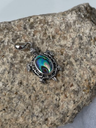 Sterling silver turtle pendant. About an inch long. Lovely silver work around the abalone.