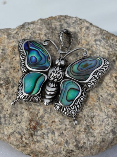 Sterling silver abalone butterfly. This butterfly is over an inch high and wide. The silver work is beautiful.