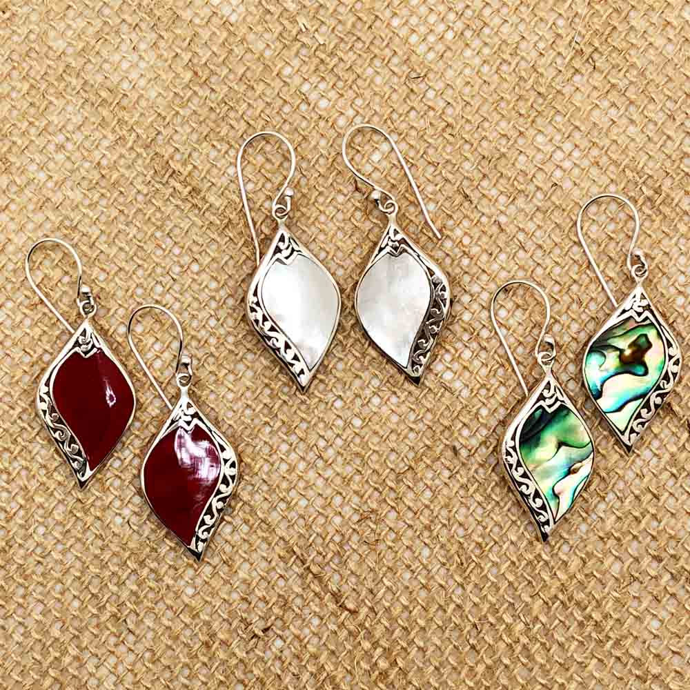 Abalone and Sterling Silver Earrings. Fish hook pierced earrings. Abalone pierced earrings. They hang about an inch and a quarter. This picture also shows the Mother of Pearl earrings and Red Coral earrings