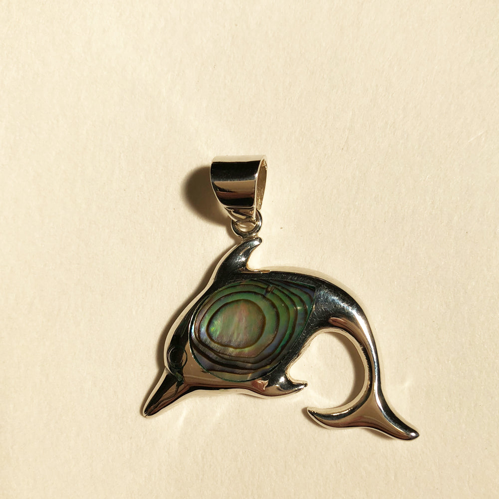 Abalone Sterling Silver Dolphin Pendant. Shiny sterling silver dolphin pendant with abalone shell in the center