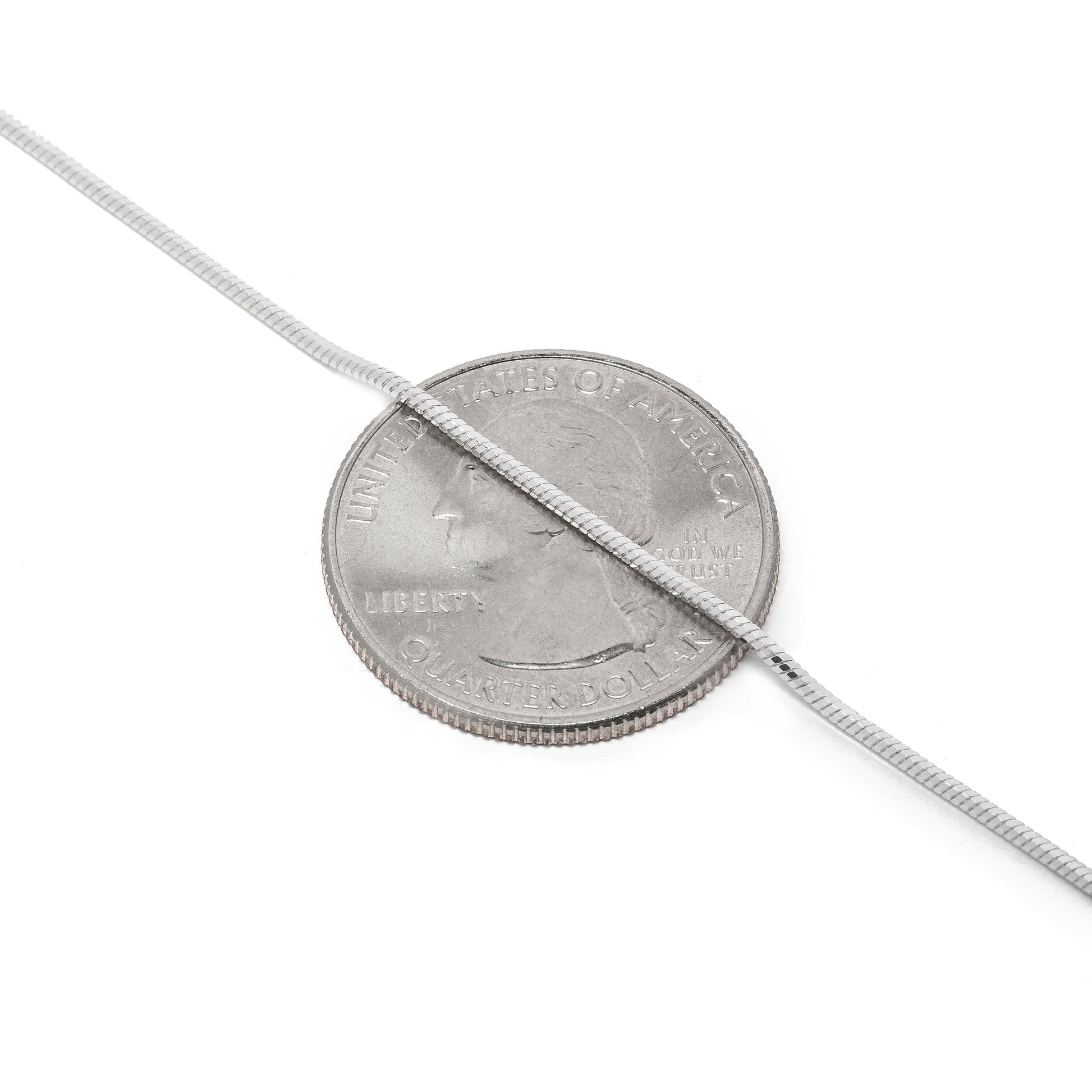 1MM MAGIC Sterling Silver 8 Sided Snake Chain with Lobster Claw Clasp. Displayed over a quarter to show you this size of the width.