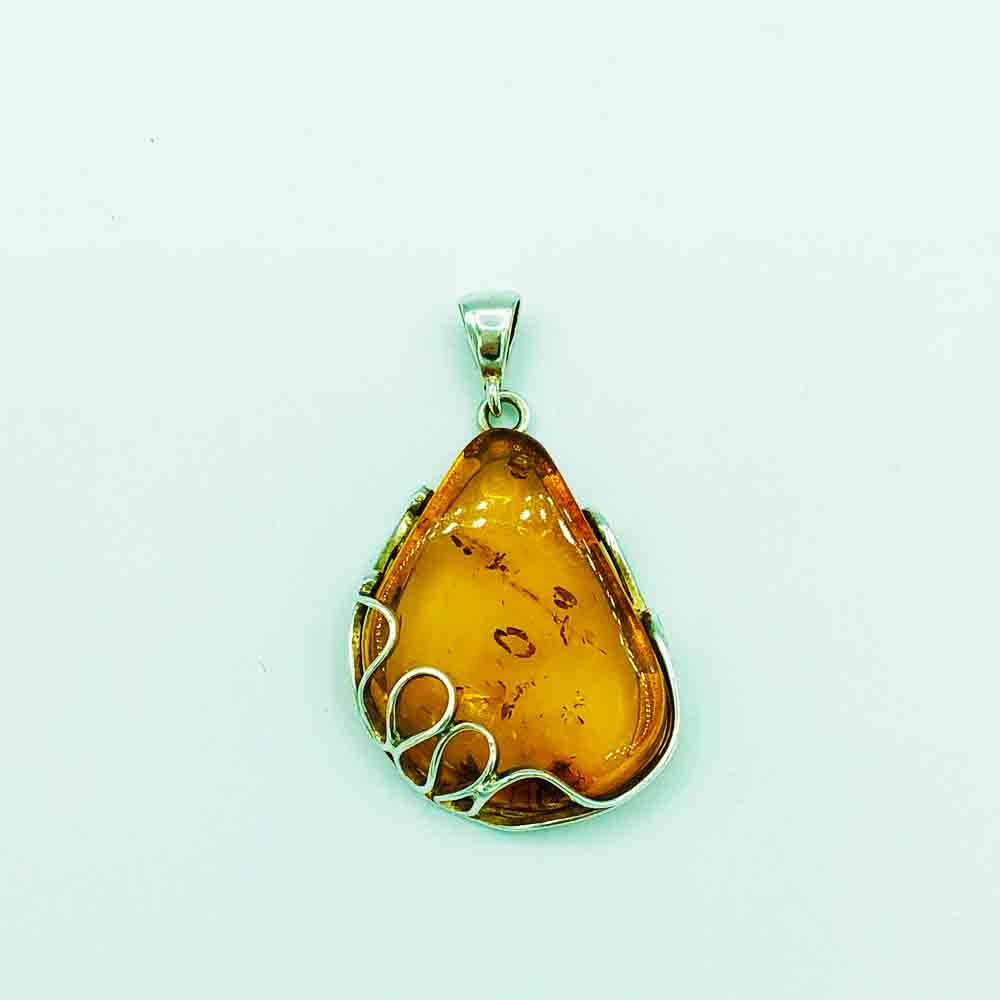Amber and Sterling Silver geometric tear drop shape, about one and 3 quarters inches Pendant