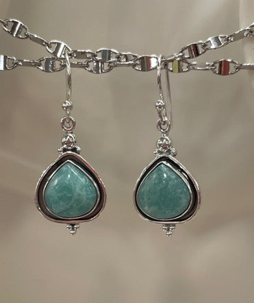Amazonite sterling silver pierced earrings. These are on fish hook claps and hang down about an inch. The stone is quite bold yet the earrings are light weight. Almost a tear drop shape in the stone.  Very lovely indeed.