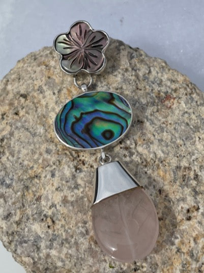 One of a kind, abalone, mother of pearl and Rose quartz pendant. The pendant hangs down about 2 inches. Is very unique and lovely.