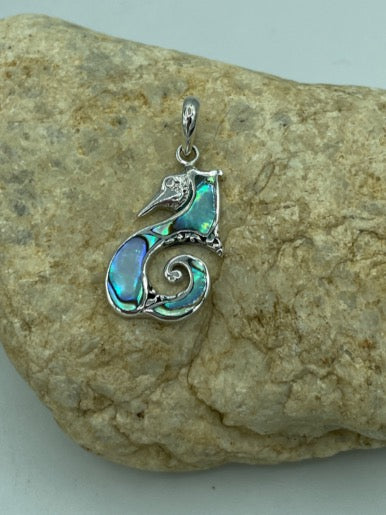 Seahorse sterling silver abalone pendant. This seahorse is charming. The abalone shimmers and shines. The pendant hangs about 1 inch.