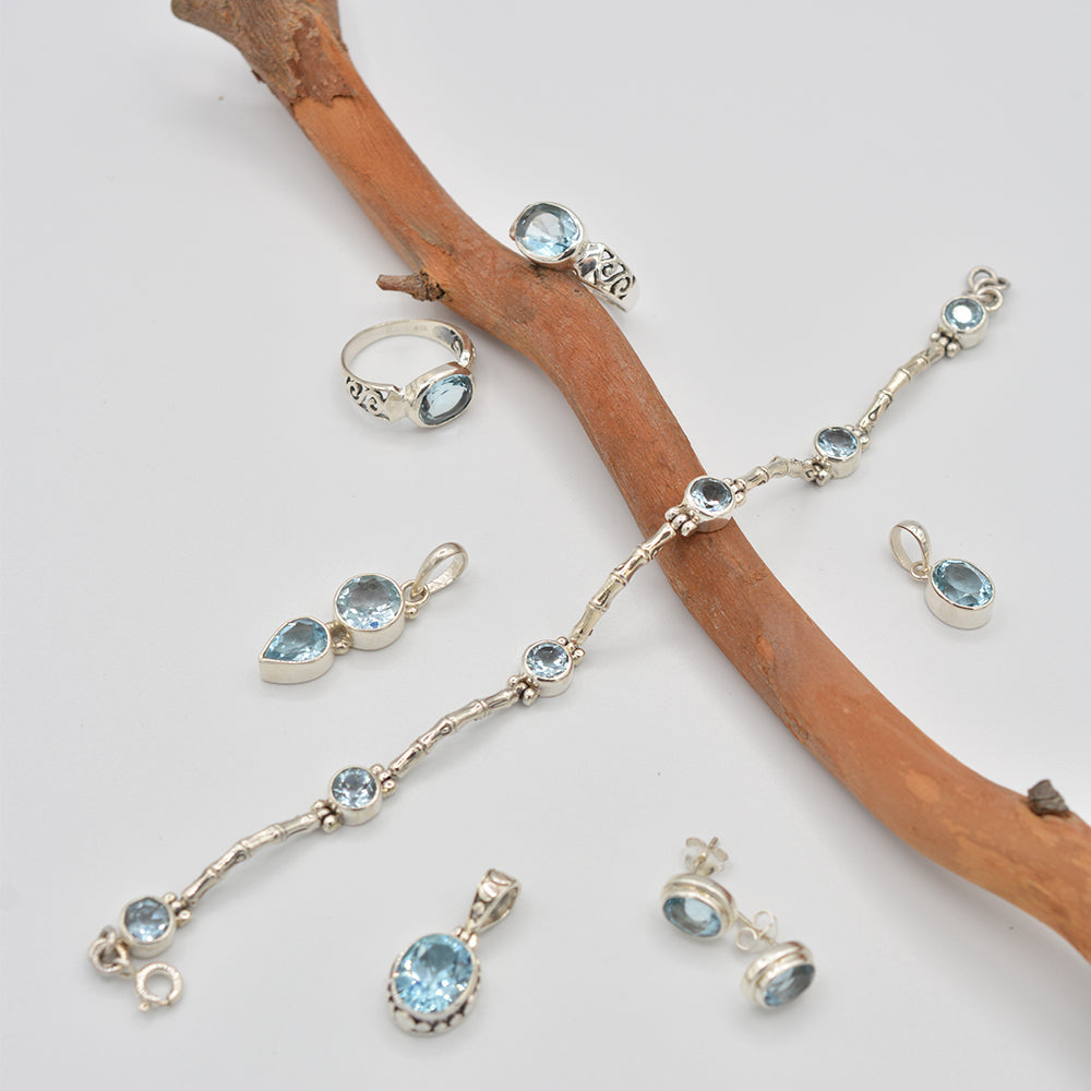 Blue Topaz round semi-precious stone Sterling Silver toggle Bracelet, 925 silver 7"-8" 6 blue topaz stones. Shown also is a ring to match as well as pendants and earrings.