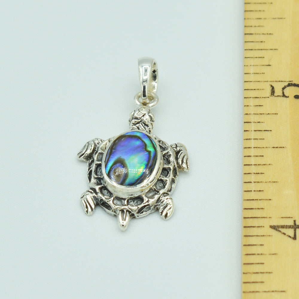 Abalone and Sterling Silver Turtle Pendant. About 1" long. The abalone is hand cut, pendant from Bali.