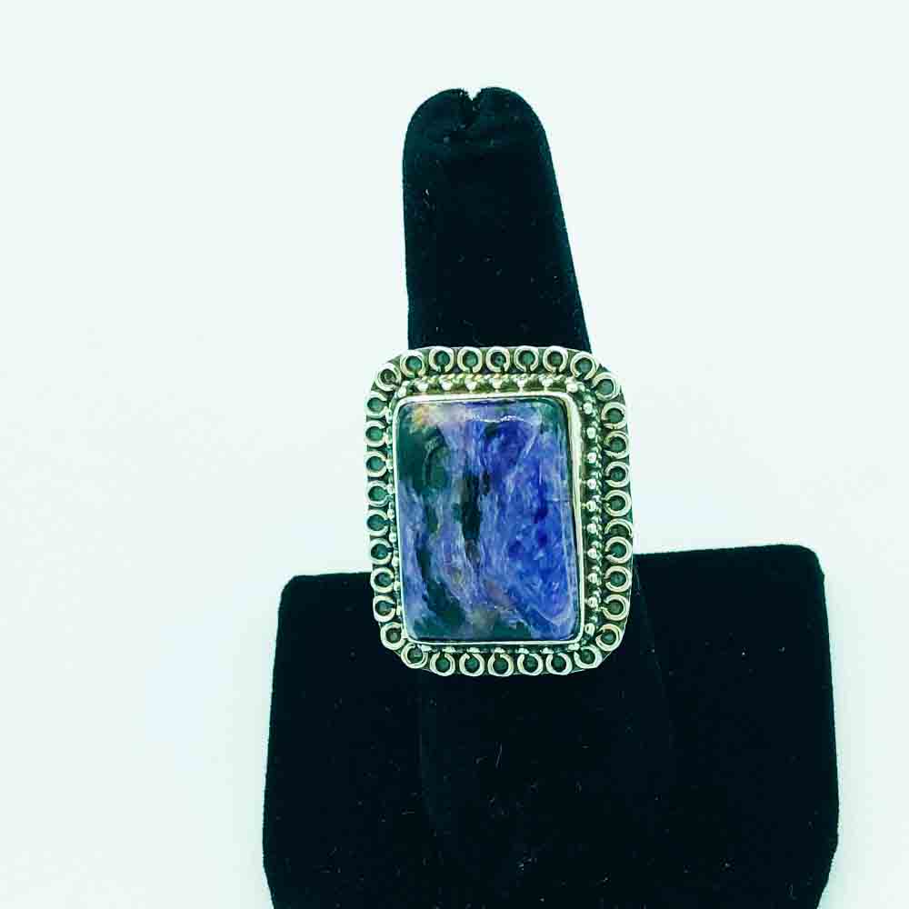 Charoite and Sterling Silver Ring-size 8. The face of the ring is about the size of a quarter although the ring is a rectangle shape.