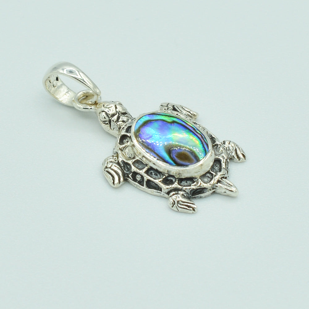 Abalone and Sterling Silver Turtle Pendant. About 1" long. The abalone is hand cut, pendant from Bali.